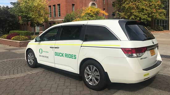 Duck Rides van parked on campus