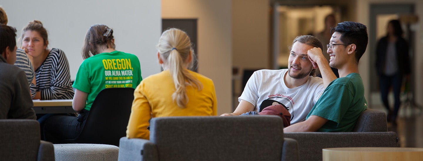 Students visit in an EMU lounge