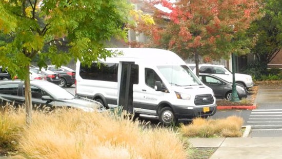 UO Access Shuttle parked in a parking lot
